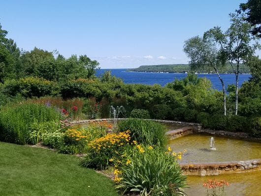 Tiered gardens at County House Resort with Sister Bay in background