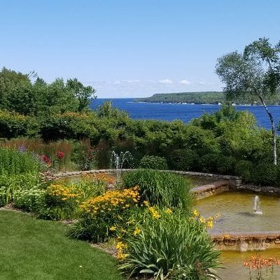 Tiered gardens at County House Resort with Sister Bay in background